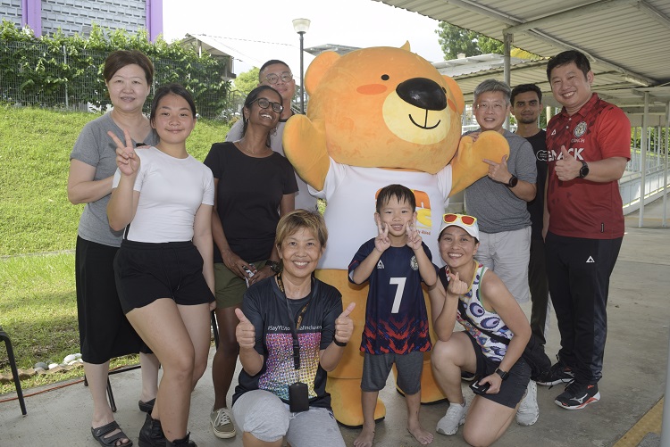 Volunteers pose for photo after car wash